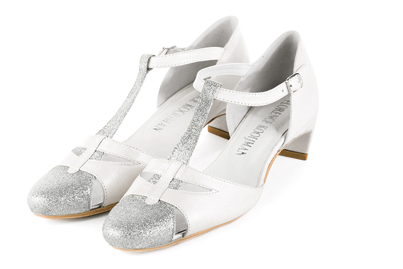 Light silver and pure white women's T-strap open side shoes. Round toe. Low comma heels. Front view - Florence KOOIJMAN